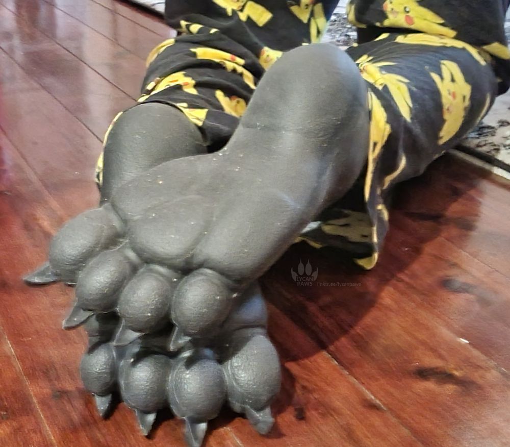 My feet wearing silicone beast paws