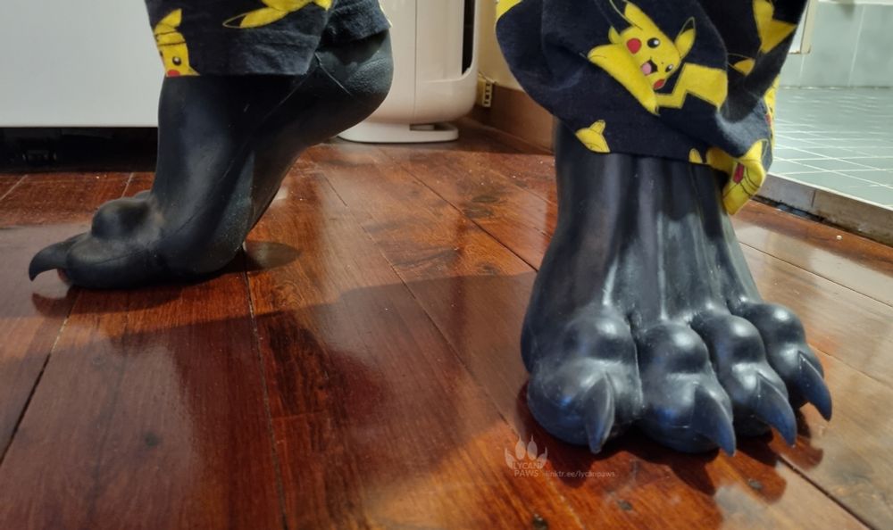 My feet wearing silicone beast paws