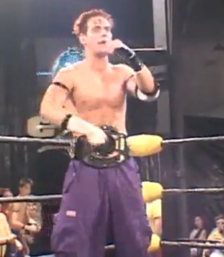 Nick Mondo in the purple pants with the CZW ironman championship around his waist