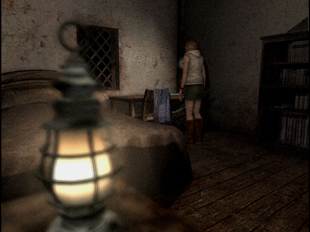 Screenshot from Silent Hill 3. The protagonist Heather stands in front of a desk at the back of the room, while a bed and lantern are in the foreground.