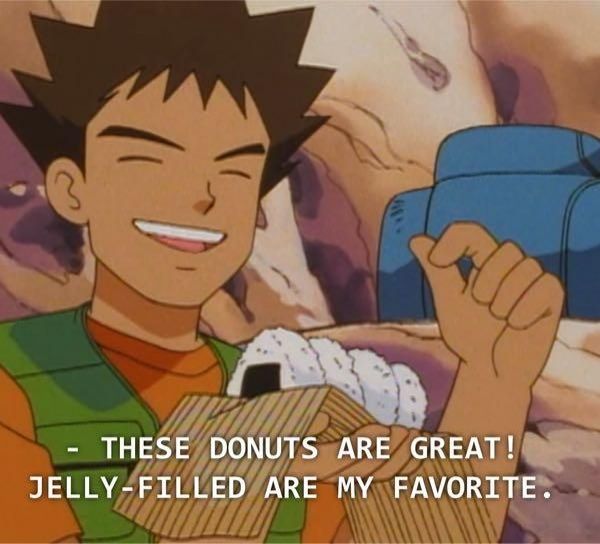 Brock from the WB Kids English dub of Pokémon holding onigiri saying "These donuts are great! Jelly-filled are my favorite"