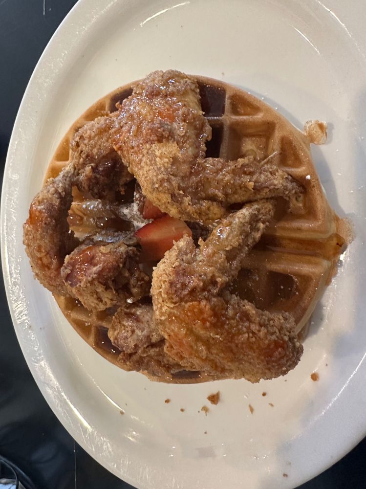 fried chicken wings on top of waffles