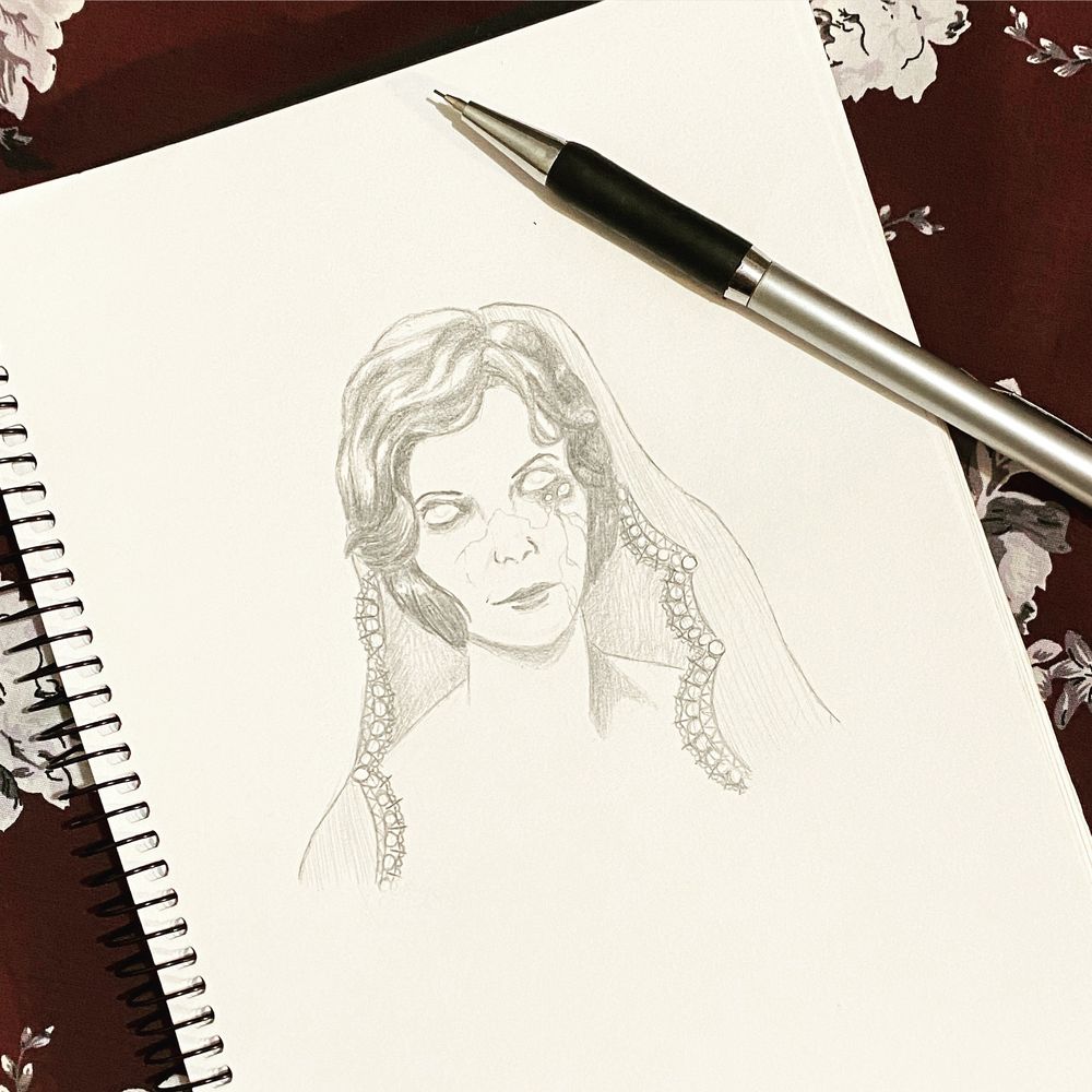 An image from my sketchbook displaying a drawing of a woman wearing a delicate lace-trimmed veil. Her face shows porcelain inspired cracks, and she possesses far too many eyes.