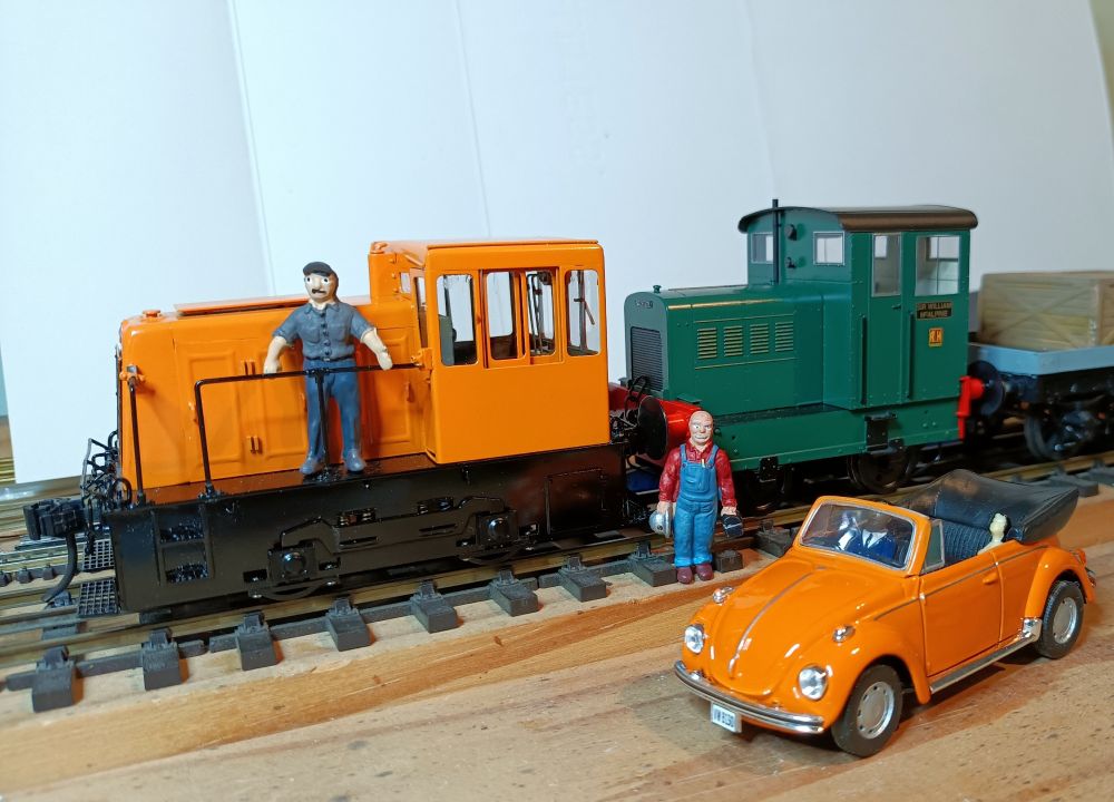 US & UK smallest model rail switcher locos in O Scale meet with VW coupe car