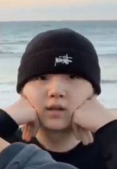 Yoongi pressing his hands to his cheeks making him look so round