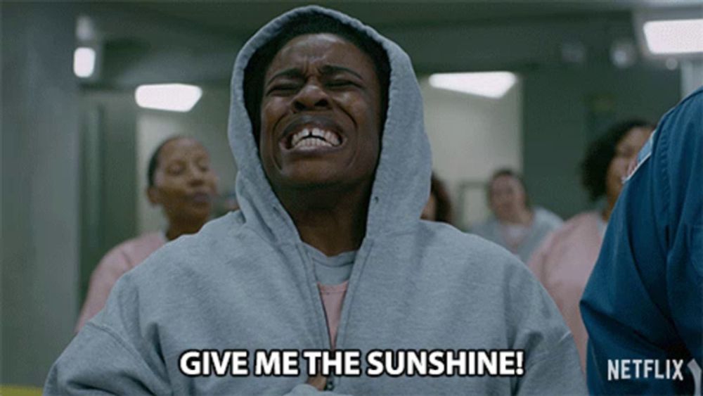 a woman in a hooded sweatshirt is crying and says give me the sunshine