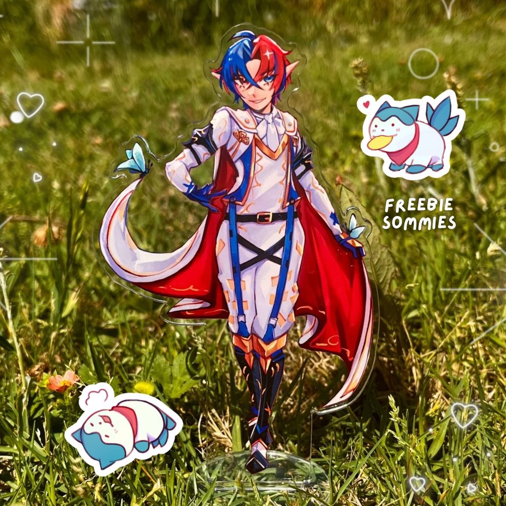 15cm acrylic standee of Alear from Fire emblem engage displayed on grass ft. Freebie sommies stickers