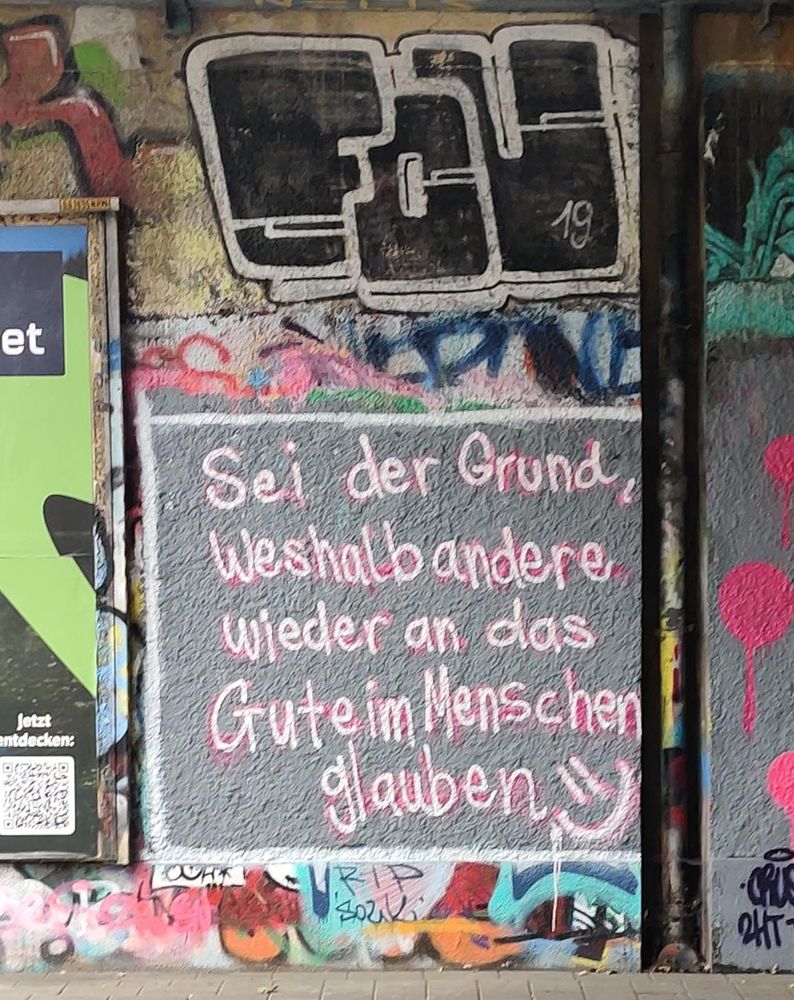 Ein Grafitti mit dem Text "Sei der Grund, Weshalb andere wieder an das Gute im Menschen glauben"