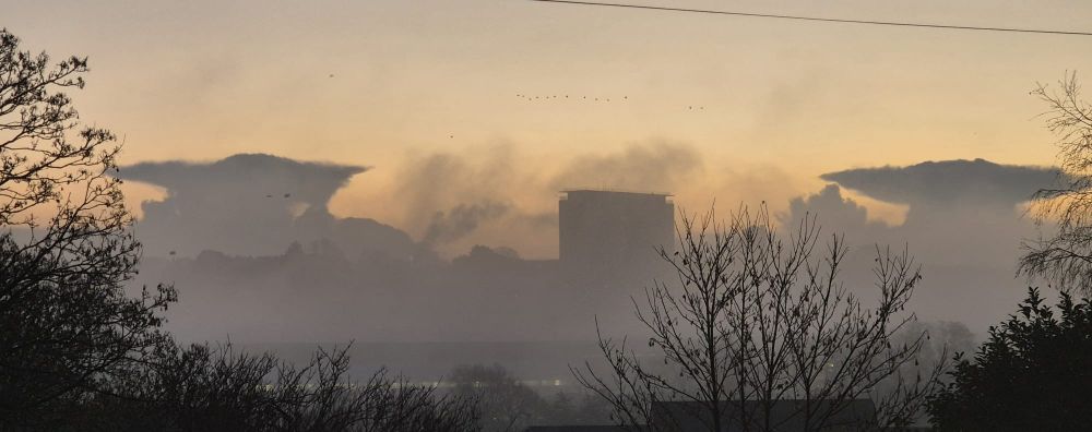 U of Exeter Physics Department Building Flanked by Stranger Things-esque cloud formations