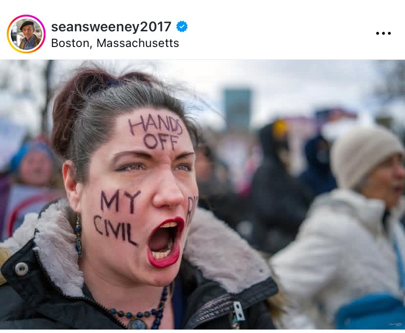 Impassioned woman with hands off my civil rights written on her face