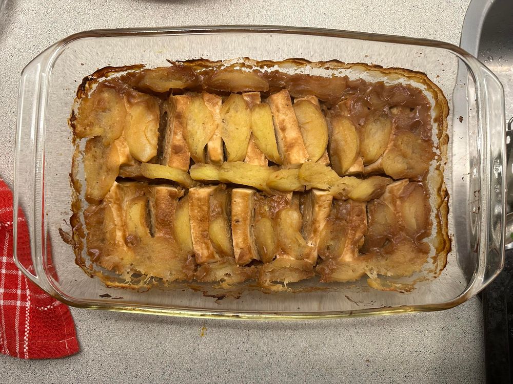 Casserole dish with tofu and apples in a miso sauce.