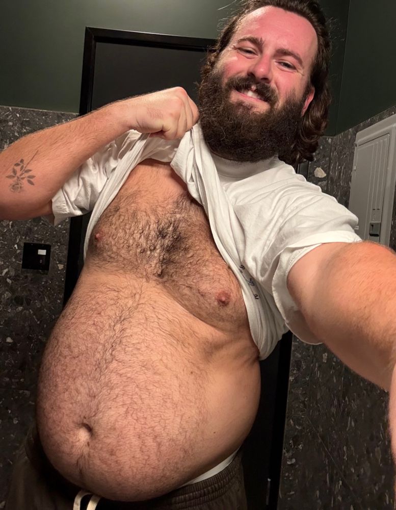Man flaunting belly