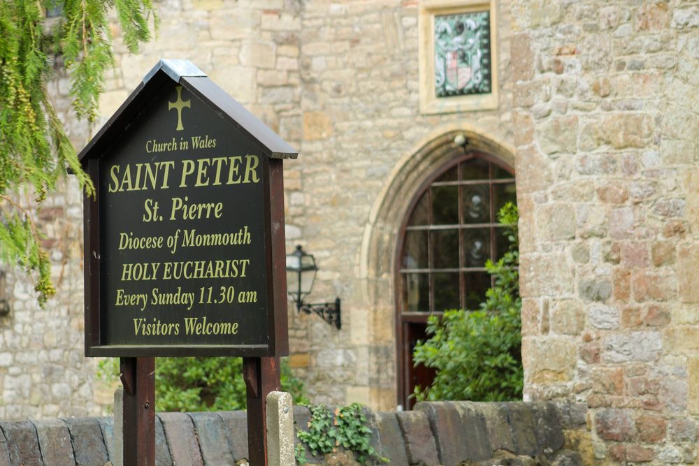 A picture of the sign outside of St Peter's church, Chepstow.