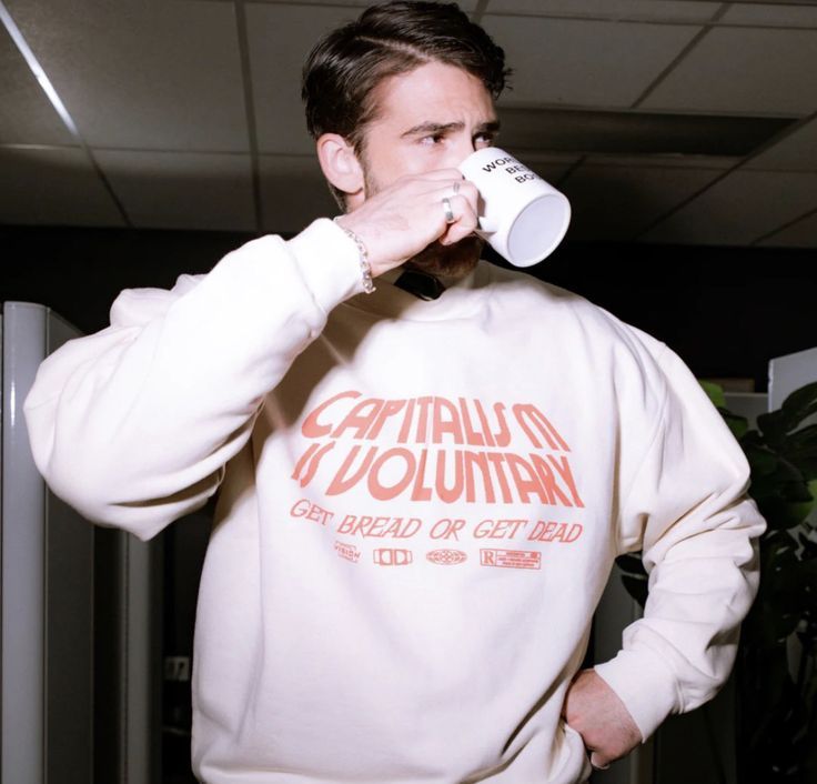 "Capitalism is voluntary, get bread or get dead" in a font reminiscent of an Arts and Crafts style