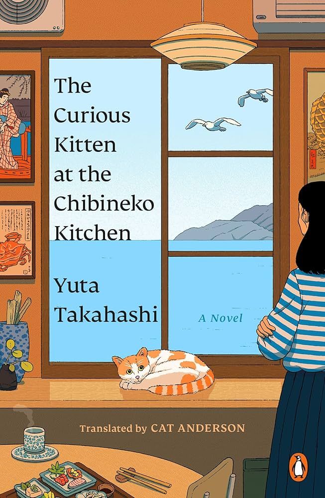 Cover of "The Curious Kitten at the Chibineko Kitchen" by Yata Takahashi features a woman standing inside the restaurant staring out at Tokyo Bay while a kitten lays curled up on the window sill. 