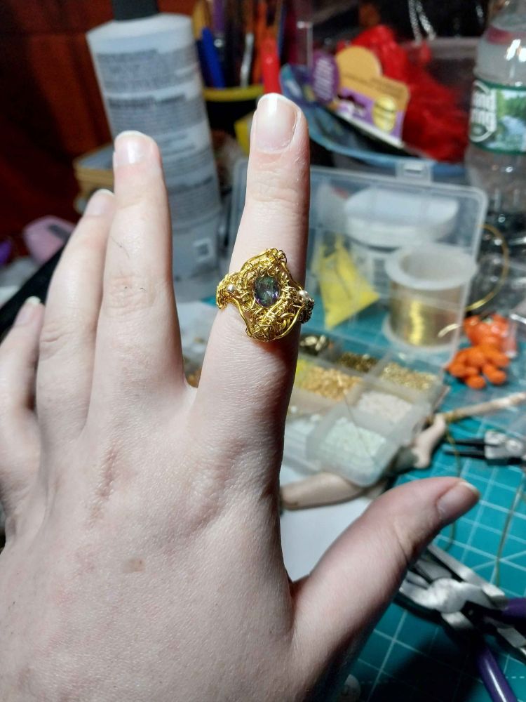 Gold wire wrapped ring with mystic topaz