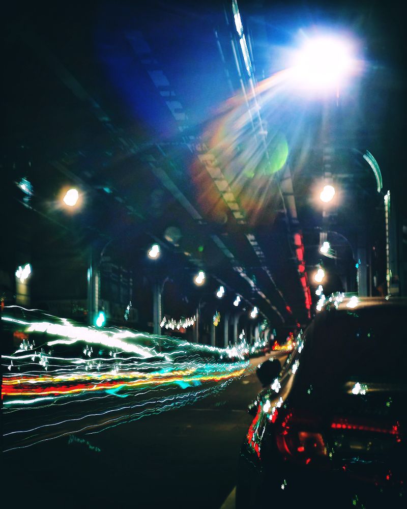 Under a Philly bridge, capturing jagged light trails with my unsteady hands shaken by the beat of the music playing in my car.