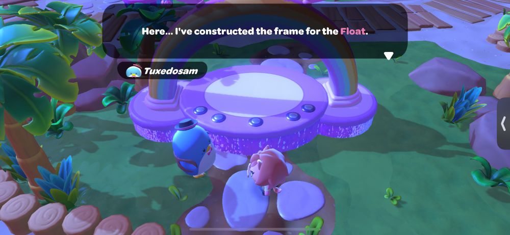 Screenshot of Hello Kitty Island Adventure where the character Tuxedosam is standing in front of a rainbow float. He is saying “Here… I’ve constructed the frame for the float.”