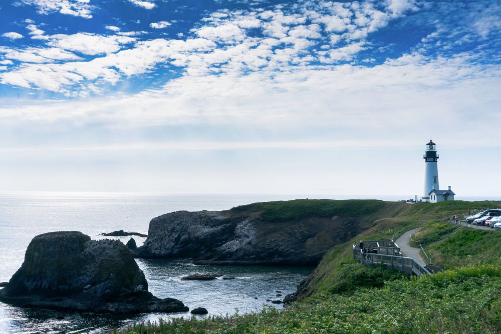 Landscape photo of Yaquina Lighthouse and the stairs leading down to the nearby tide pools. Yaquina Head Outstanding Natural Area, OR. July 29, 2023. Sony A7 + Zeiss 35mm f/2.8.