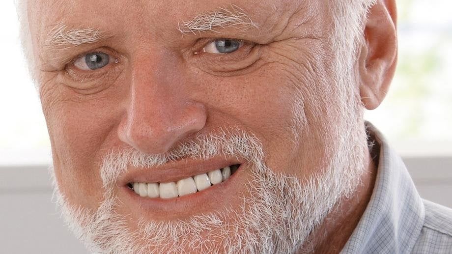 An image of Hide the Pain Harold, smiling a lifeless smile into the camera and pain can be seen in his eyes.