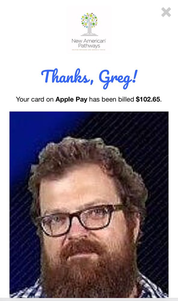 Photo of Spencer with a donation amount 