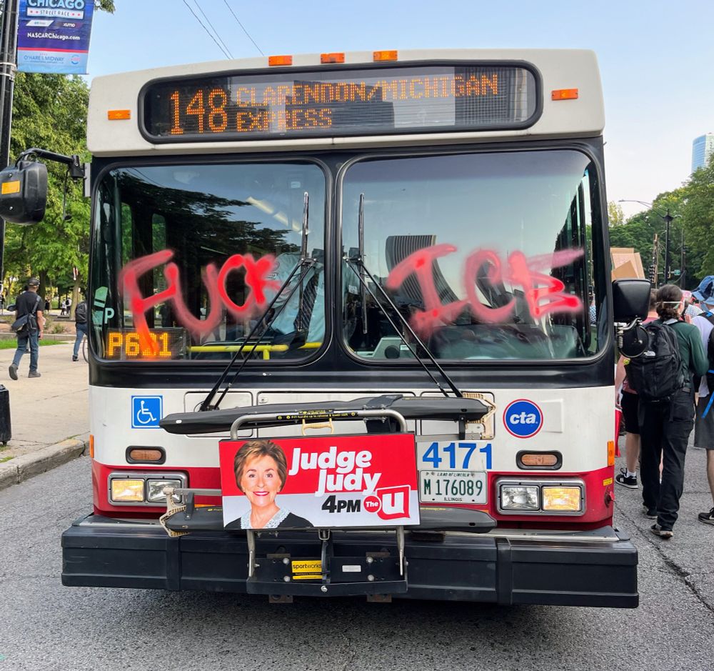 A city bus with the words Fuck ICE written on its windshield
