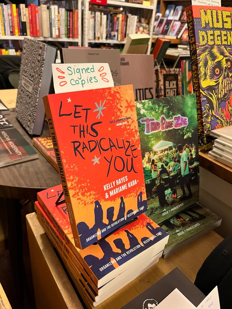 A stack of copies of Let This Radicalize You at a bookstore. There is a note poking out of the book on top that says “signed copies.”