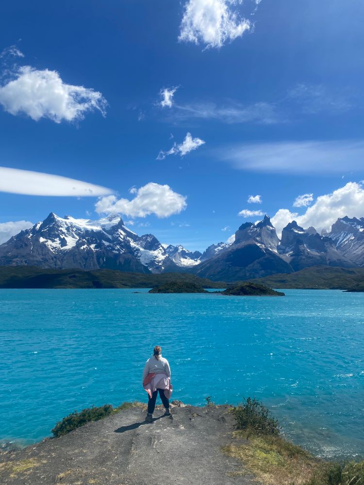 my wife in front of a lake below Torres del Paine