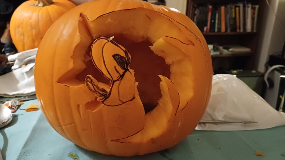 A pumpkin with most of the sonic silhouette cut out minus the eyes. 