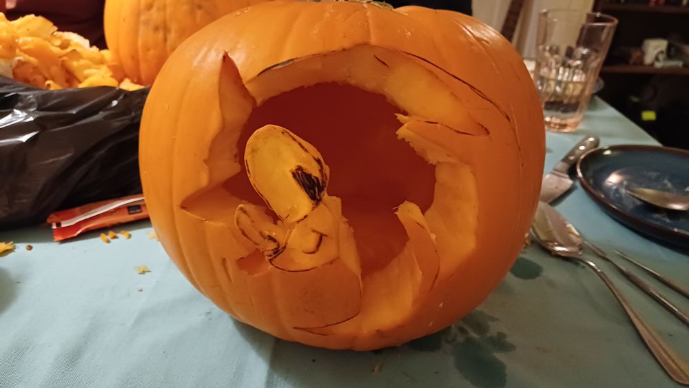 A pumpkin with all of the sonic symbol cut out and the eyes and muzzle scrapped off a bit. 
