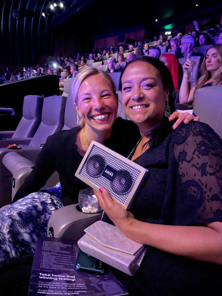 Phoebe McIndoe and Redzi Bernard smiling in the cinema after their silver award win