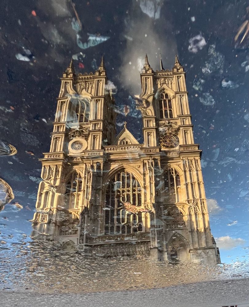 reflection of Westminster Abbey in a puddle 
