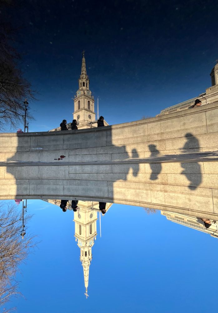 St Martin in the Fields church reflected in a puddle 