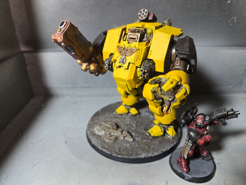 Imperial Fist Redemptor dreadnought next to a Flesh Tearers Incursor for scale.