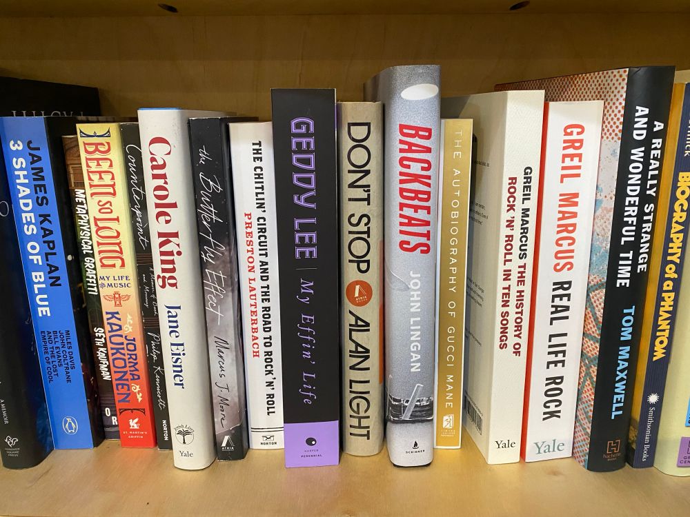 A bookshelf with my book included. 