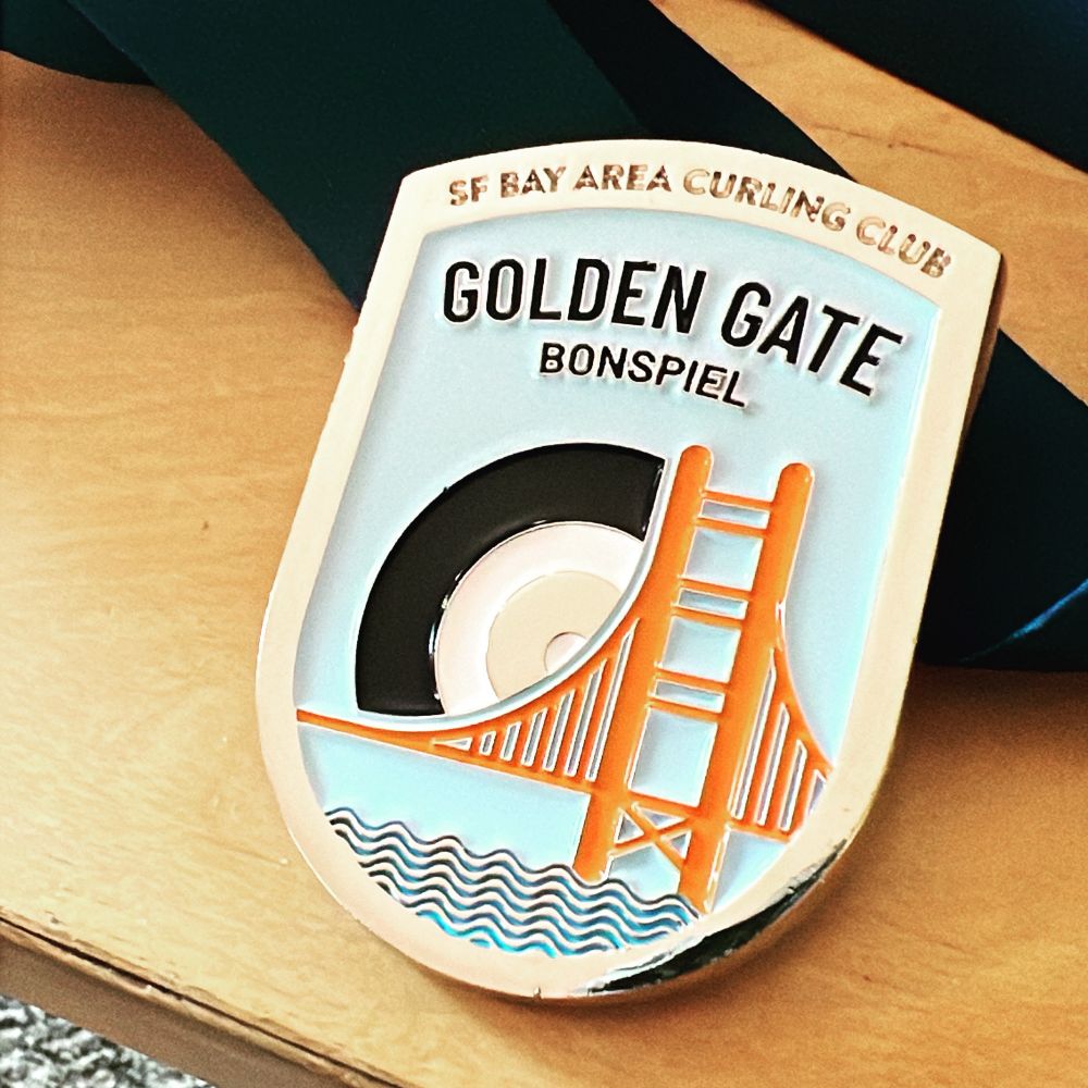 It’s a cool medal that says “SF Bay Area Curling Club - Golden Gate Bonspiel.”