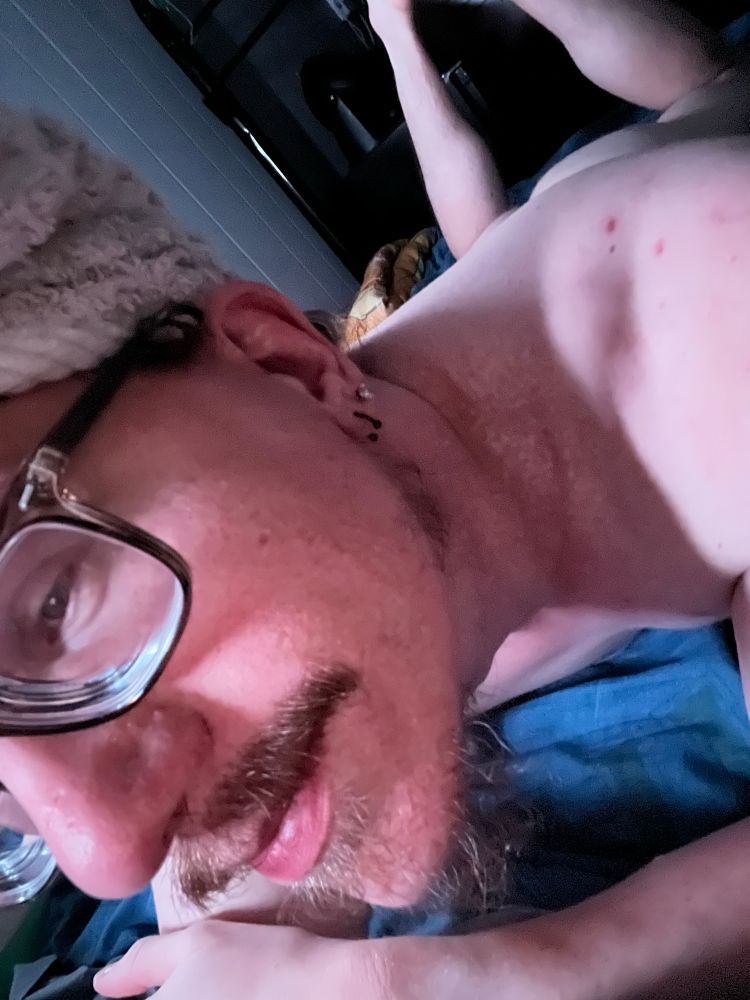 Naked of queer Behr afterwards the shower. Eyeglasses with smirks and scuff beard and mustache. Show a naked butt laying on the bed. 