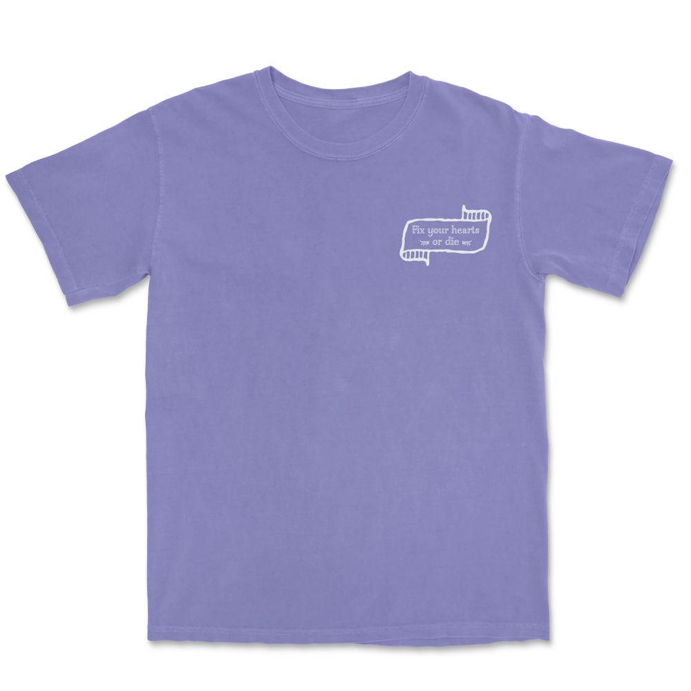 A purple tee (available in lots of other colors) with “Fix your hearts or die” in the area where a pocket would be, if these shirts had pockets — if you want to be less loud, for some reason