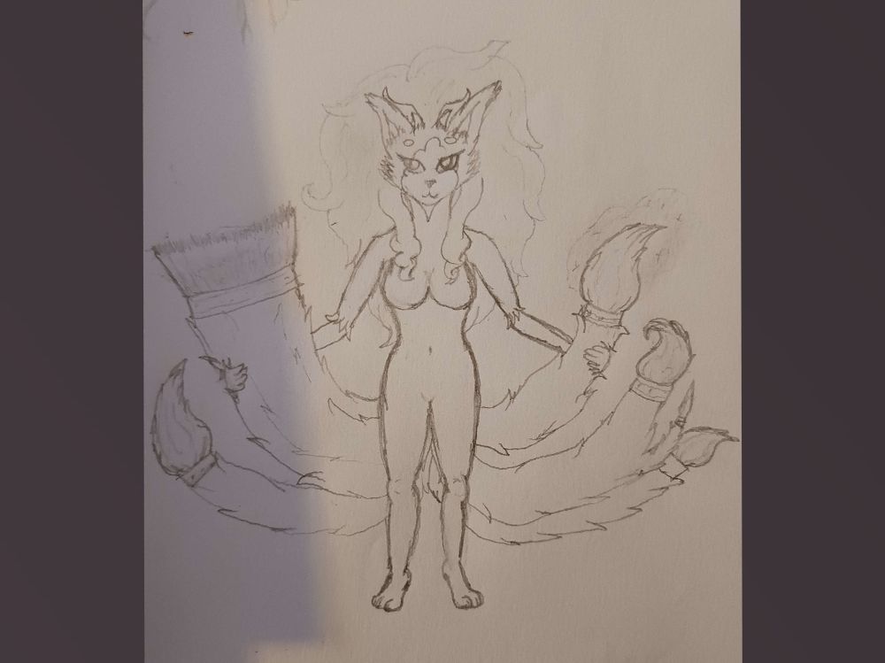 Gaho with golden rings (technically one, unimportant "lore" detail) around the end of her tails, making the tips look like paintbrushes 
She has 7 tails in this pic (varies between 7 and 9), 3 of them grouped to make a wide flat brush, one of the tails split to show a tiny brush, all the others being the same size