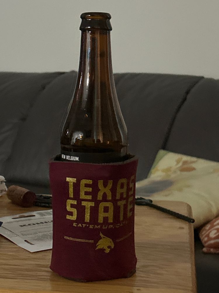 A bottle of voodoo range imperial IA in a Texas state couzzi.