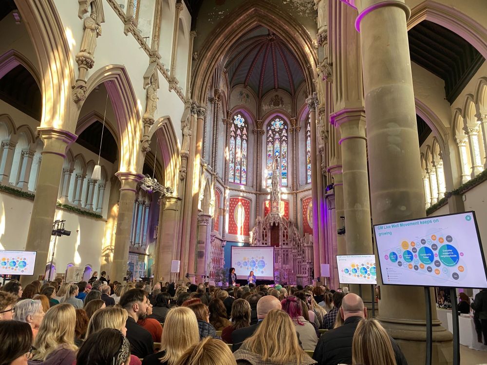 An image of a large audience at Gorton Monastery.