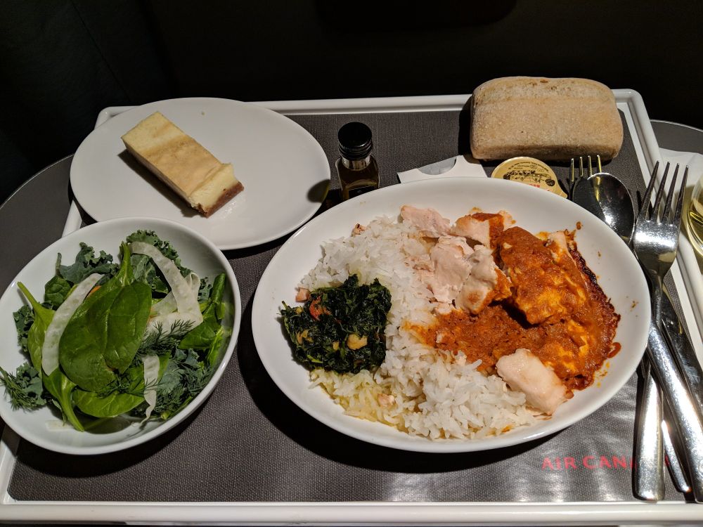 Chicken and rice airplane meal in Business Class on Air Canada.