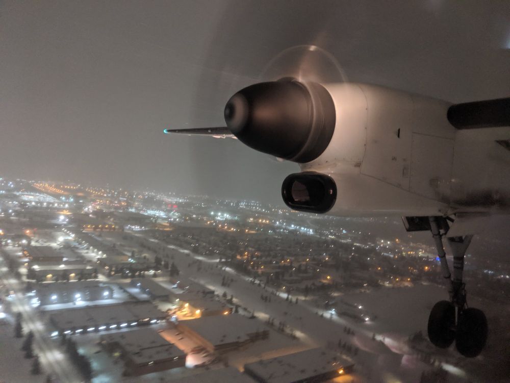 The wing, engine and main landing gear on the starboard (right) side of a De Havilland Dash-8 aircraft.