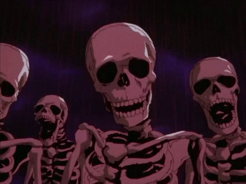 a group of skeletons with their mouths open in a dark room