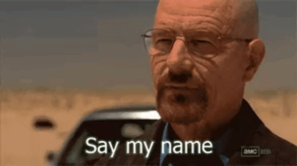 a bald man with glasses and a beard is saying `` say my name '' .