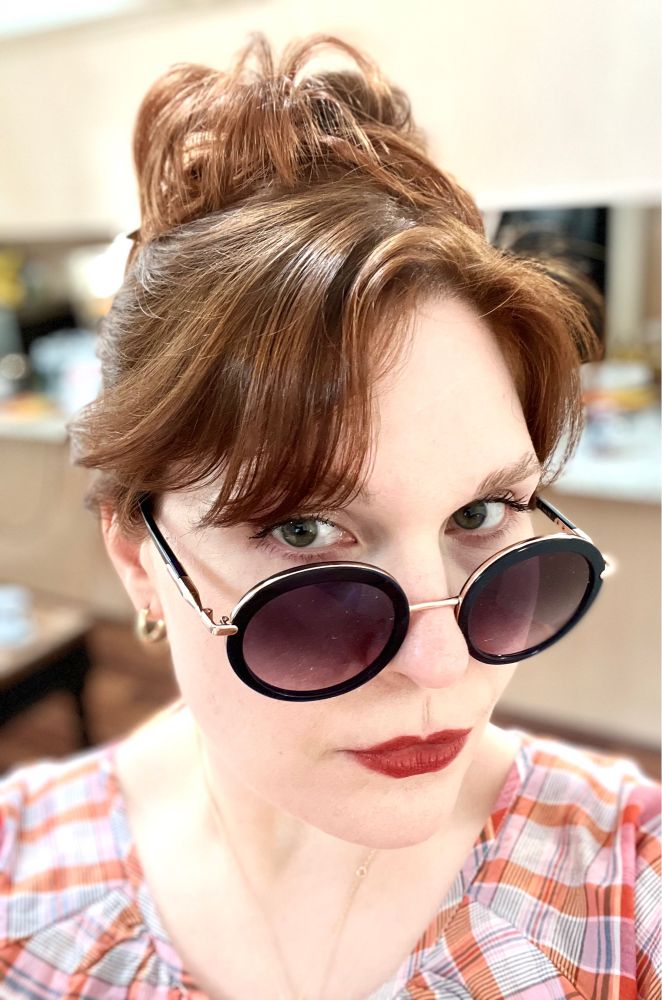 Selfie. Red messy hair, giant sunglasses, red lipstick. Pretty standard Meg.