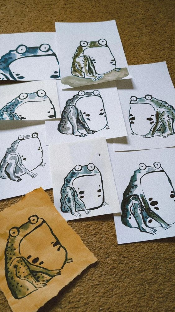 Nine different monochrome ink drawings of frogs. They all look some shade of alarmed, disgruntled, resigned or outraged.