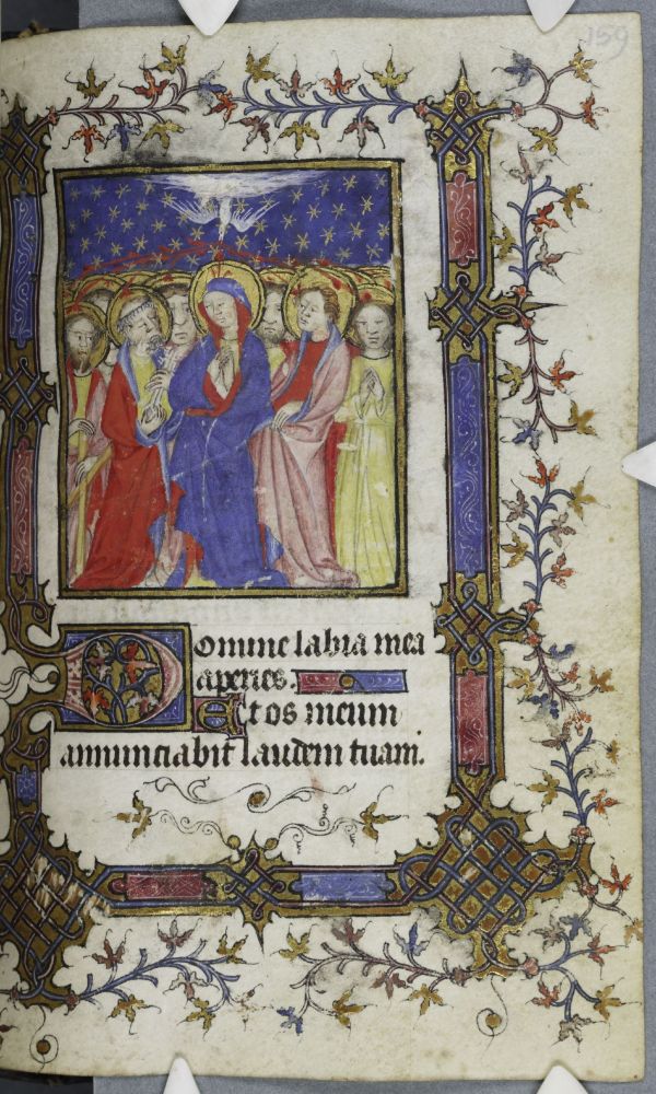 Medieval manuscript page with two thirds page framed miniature of Pentecost set against a blue ground with gold stars. White dove representing the Holy Spirit spews red inspirational lines to each head gathered around a central figure dressed in blue robe lined in red. Scale of faces is off, with the people in the background having larger faces than the people in the foreground.

There is a full border of gold, blue and pink ivy leaves with interlace at the corners. Ornamental initial of three lines with blue and pink ivy leaves.

Corpus Christi College Cambridge, MS 540, folio 159r