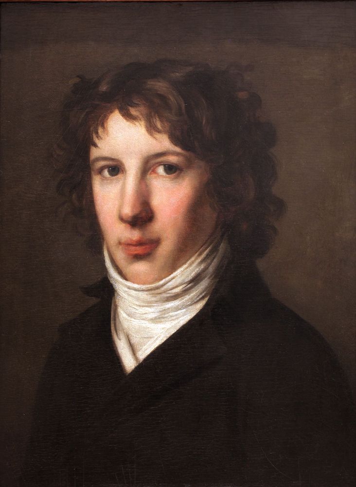 Oil painting portrait of a young man with pale skin, soft brown curls, and a calm, serious expression. He wears a high white cravat and a dark coat against a muted brown background. The light falls gently on his face, emphasizing his smooth complexion and reflective gaze.