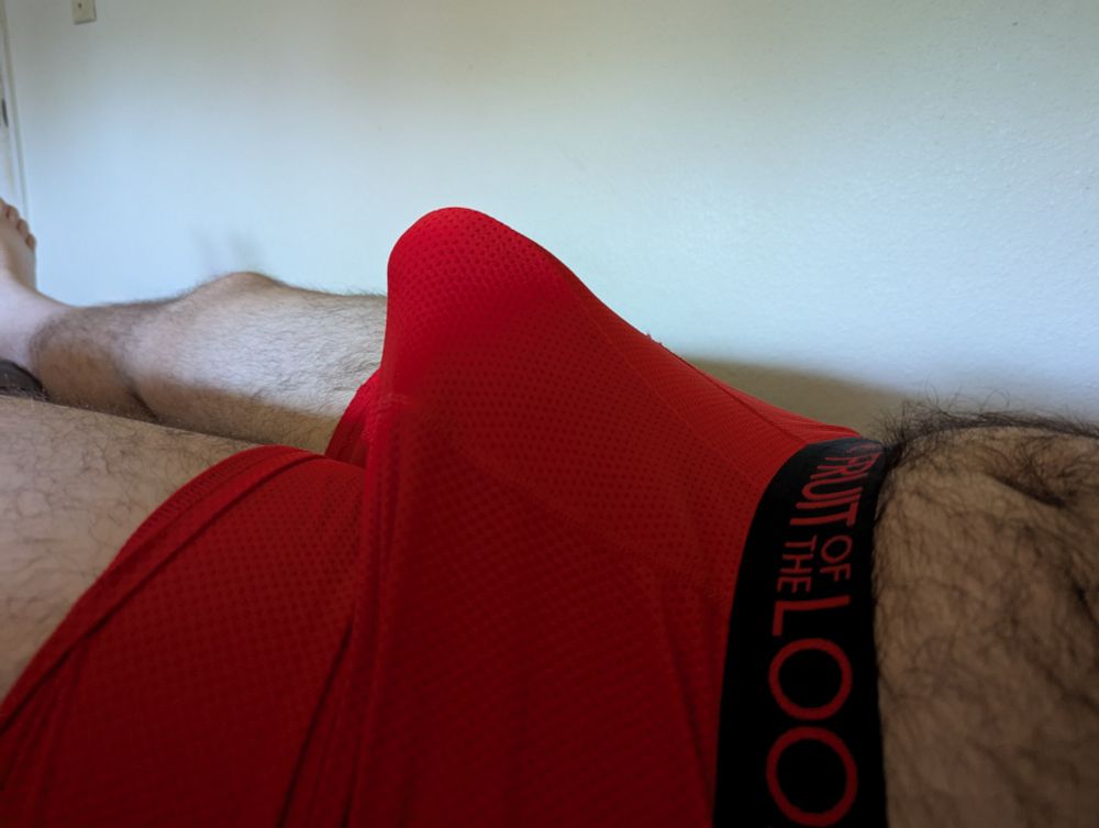 Side view of the red boxer shorts bulge